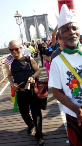 Valence Williams, l., and Menes De Griot marching over the Brooklyn bridge. (NAN Image)